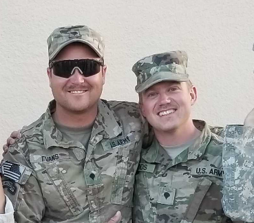 Brett Woods and a National Guard colleague during a training event in 2019.