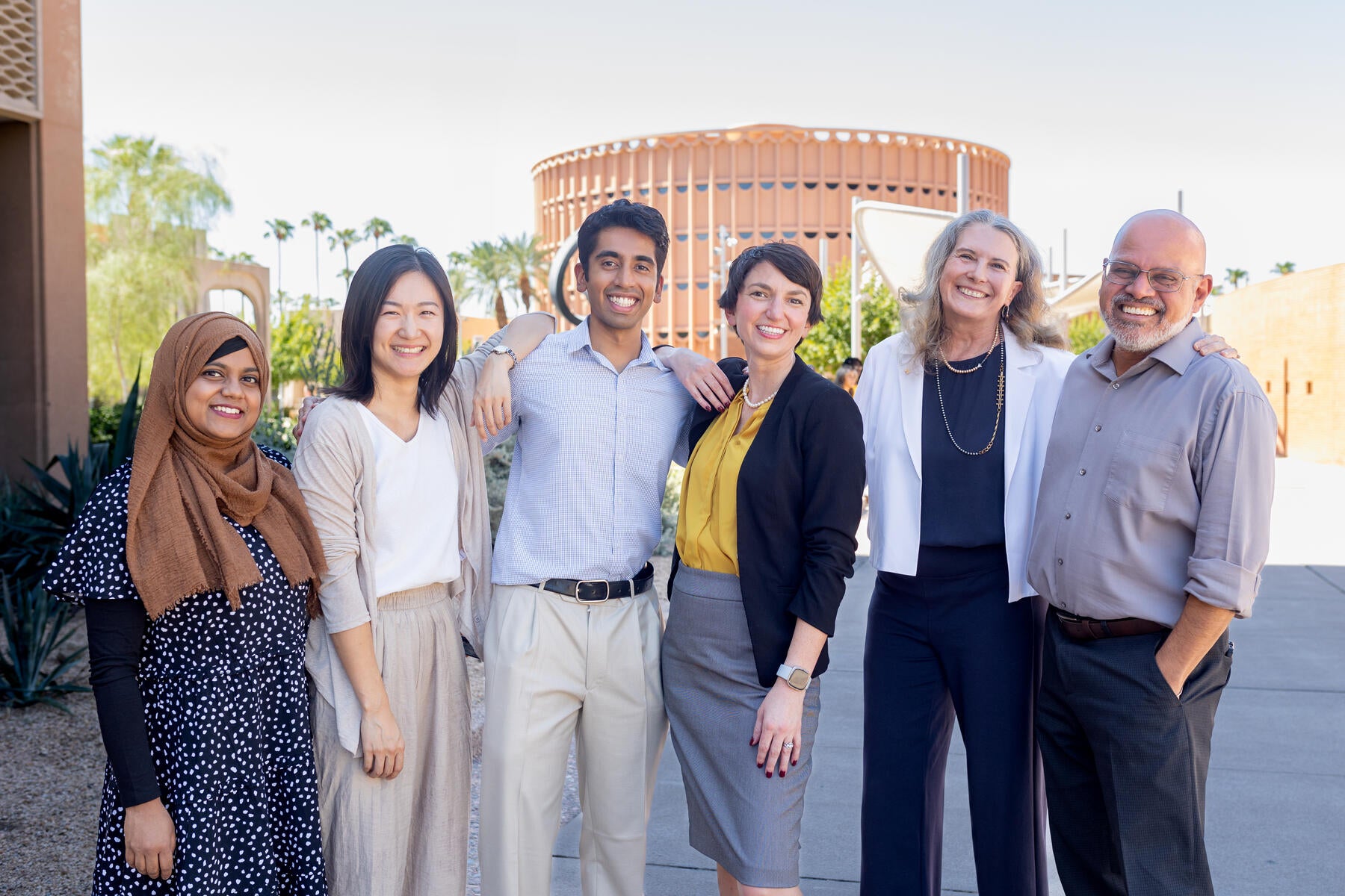 The AI Acceleration team poses in front of ASU Gammage.