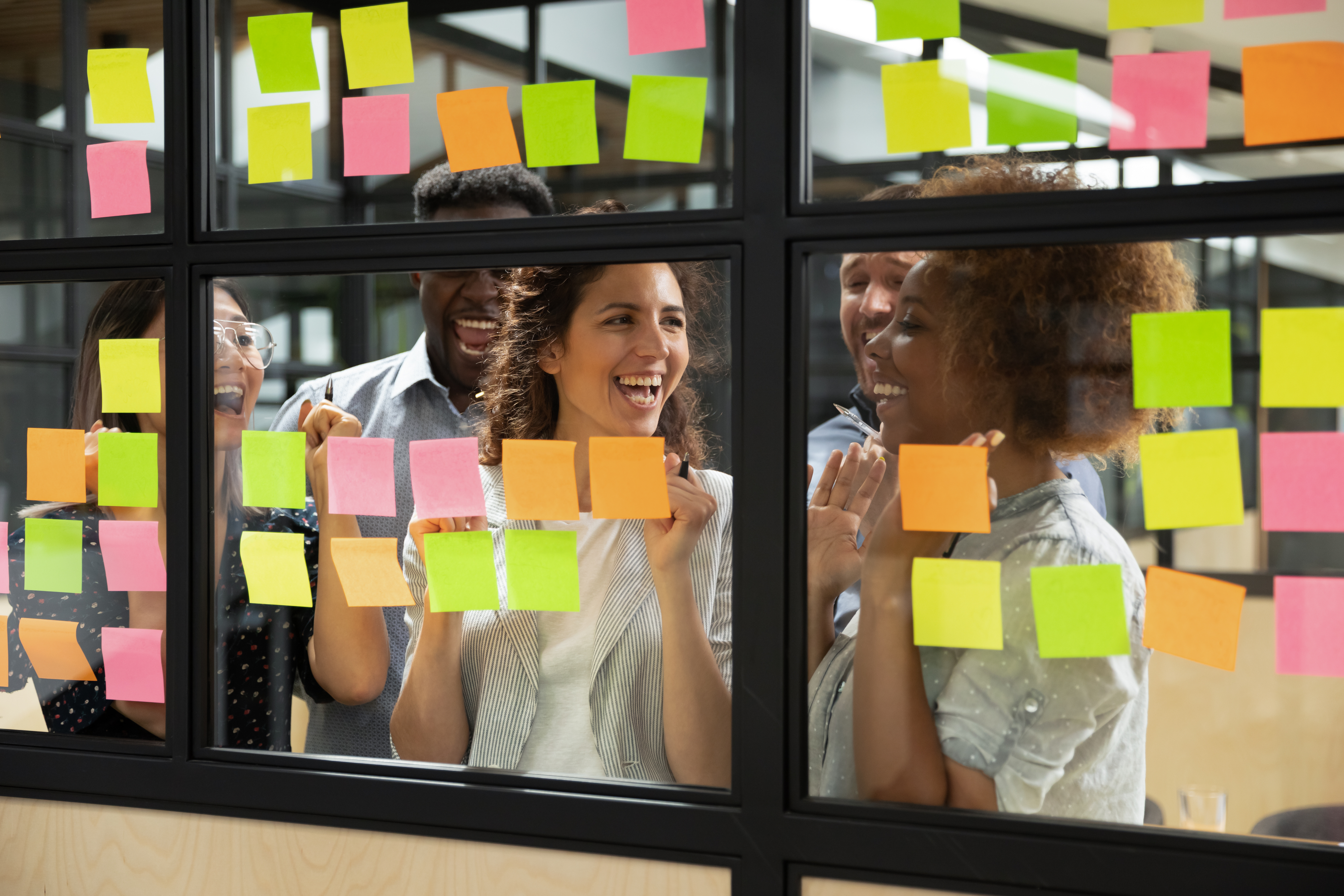 People working with post its