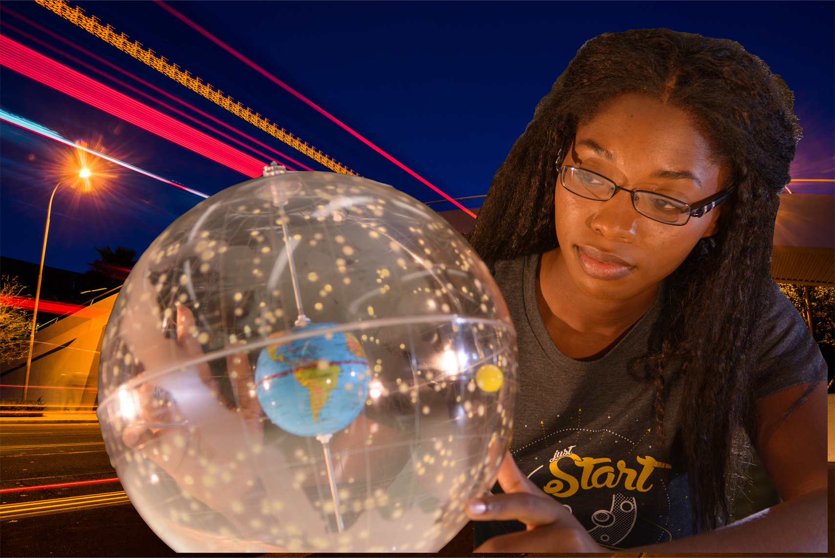 Gril with globe in front to technology