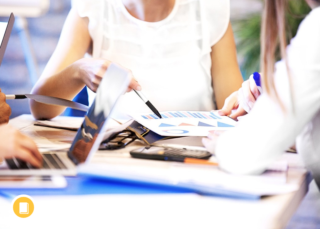 People working Generic picture of a woman sitting at a table working