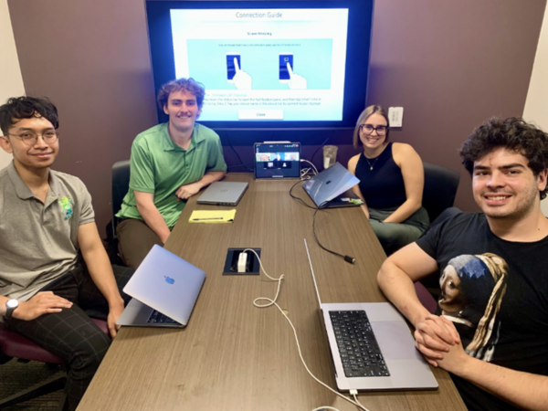ASU students who created mobile healtchare app pose in media center