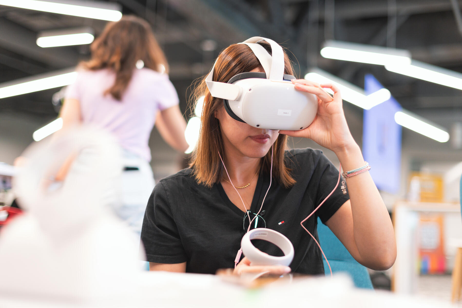 Girl in black polo wearing a virtual reality headset