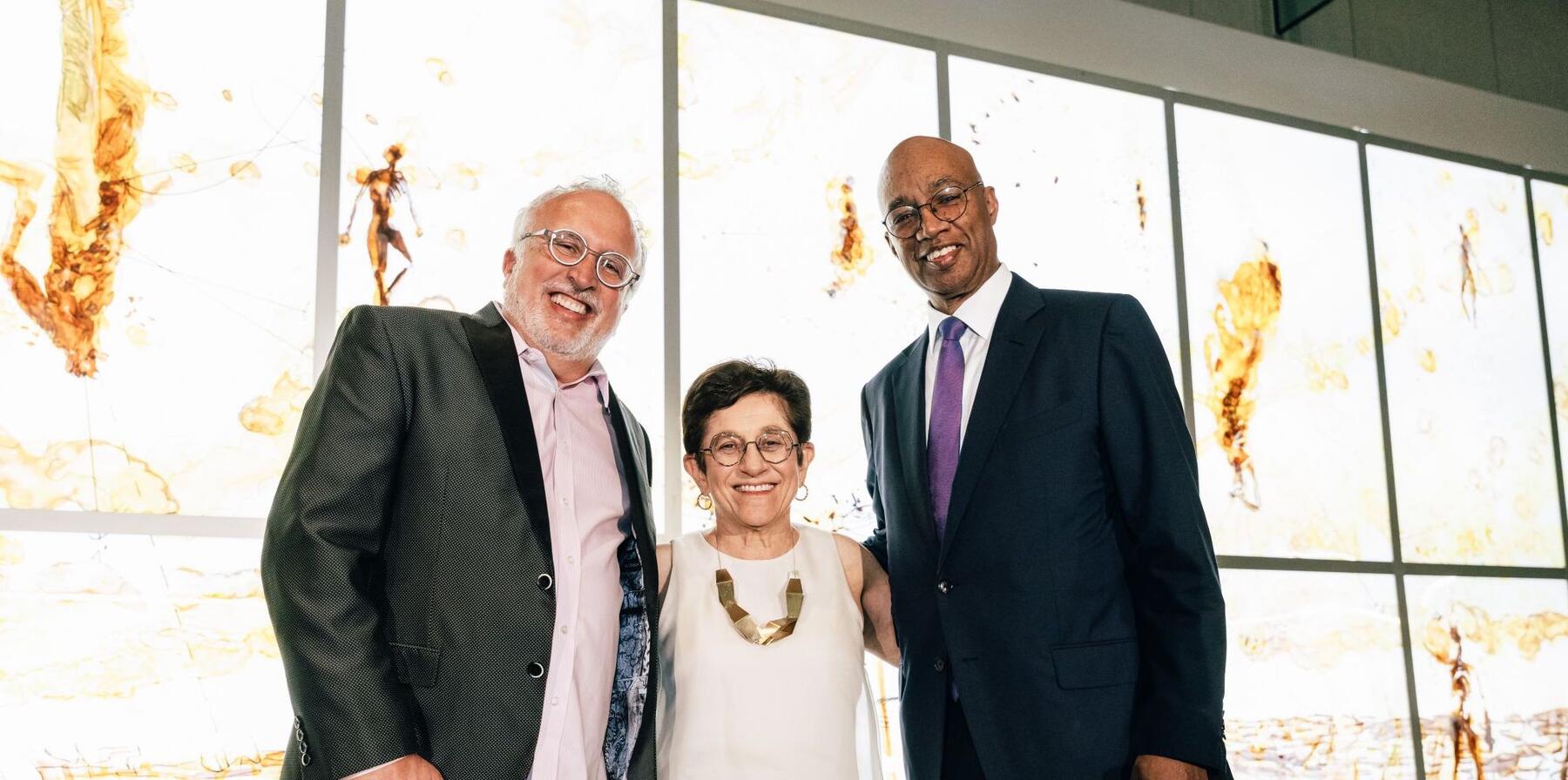 Three people standing for their photo
