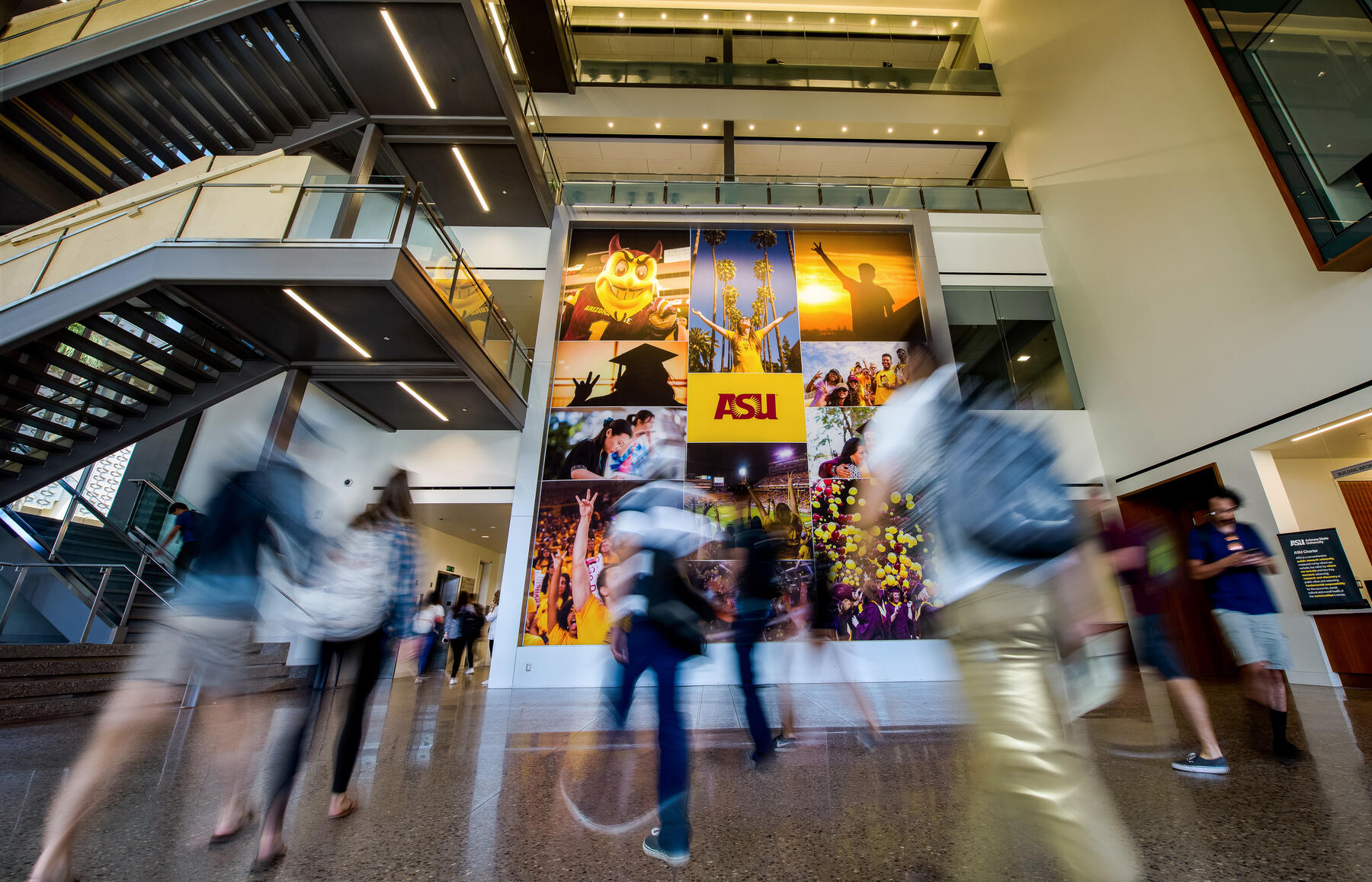 Students in motion walking in front of an ASU photo collage