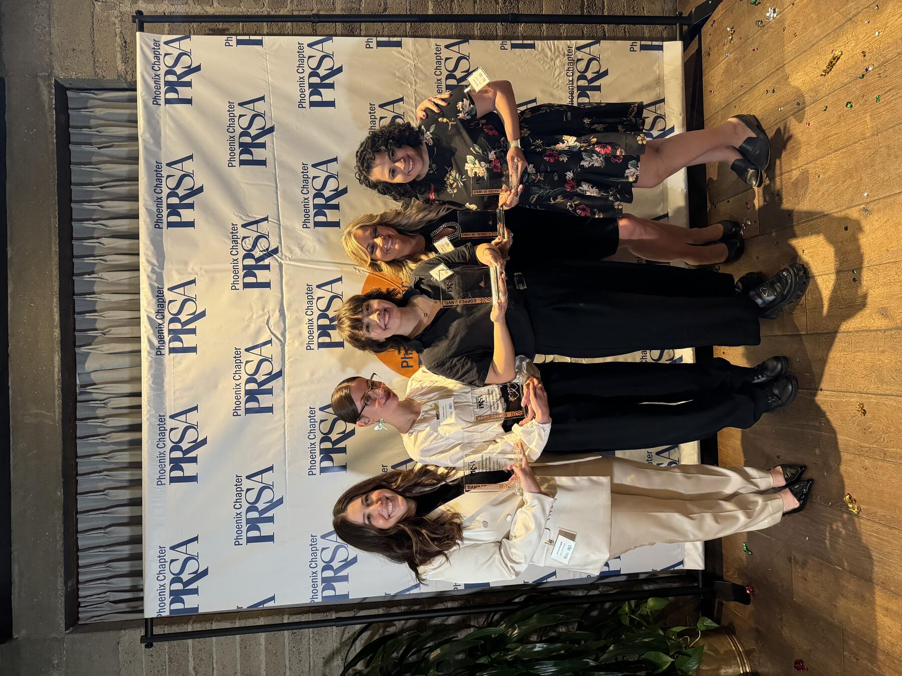 Creative and Communications poses for a picture after winning three Copper Anvil awards.