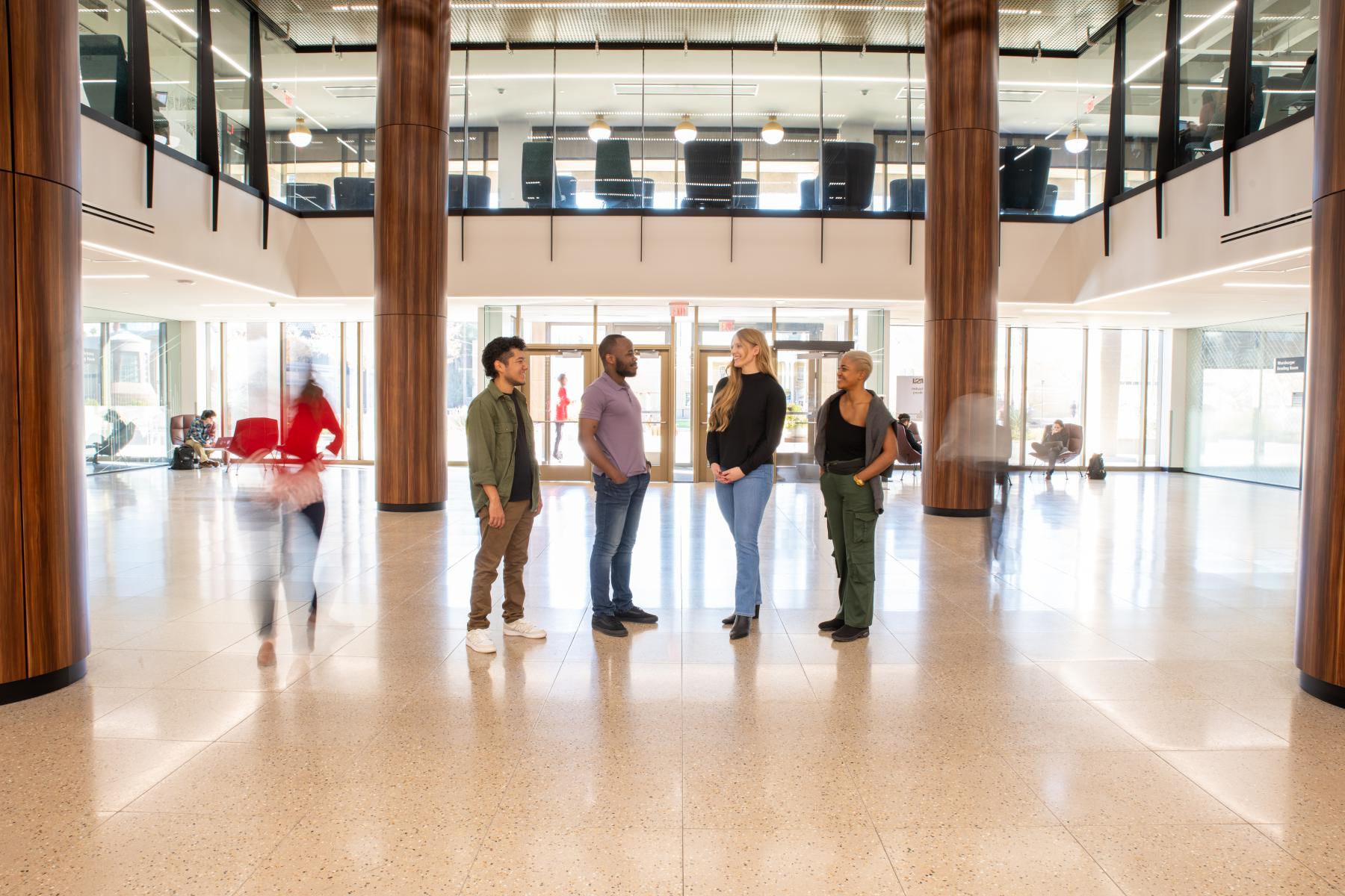 All changmakers standing in Hayden library smiling